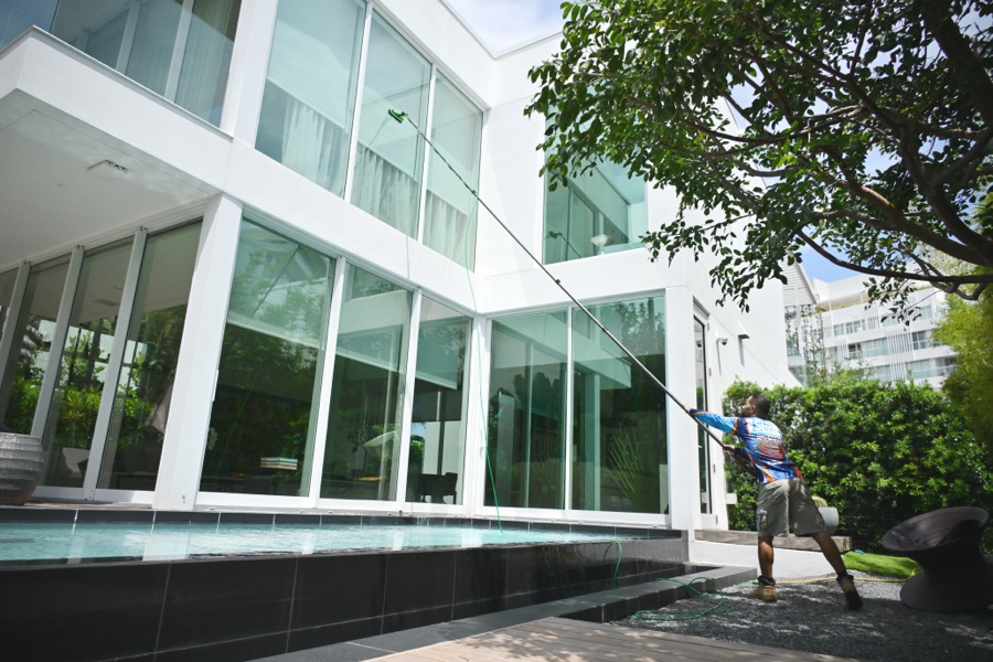 Professional exterior window cleaning on a modern home