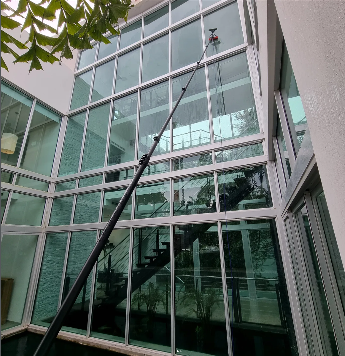 Residential window cleaning -tall glass panel building
