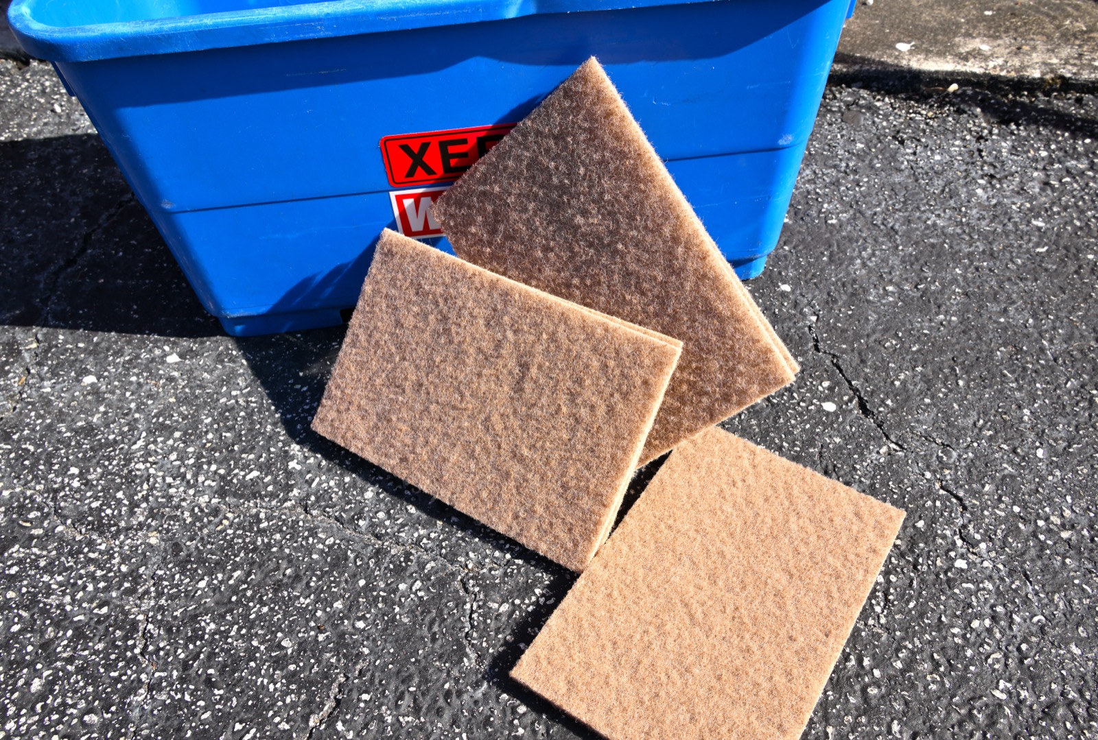 Walnut scrubber pads used by Shiny Windows for removing stubborn bird droppings and hard water stains from Miami windows