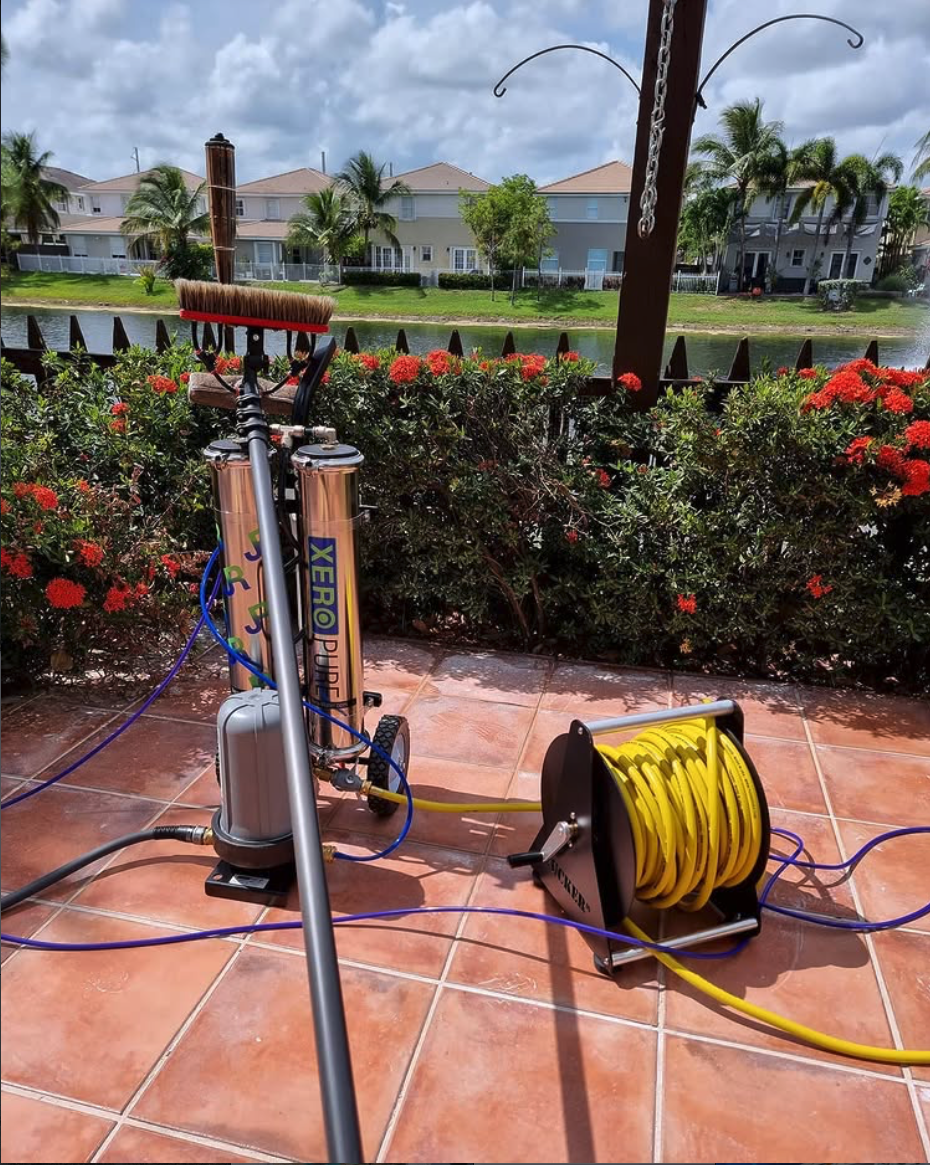 Shiny Windows professional water-fed pole cleaning system on a Miami patio